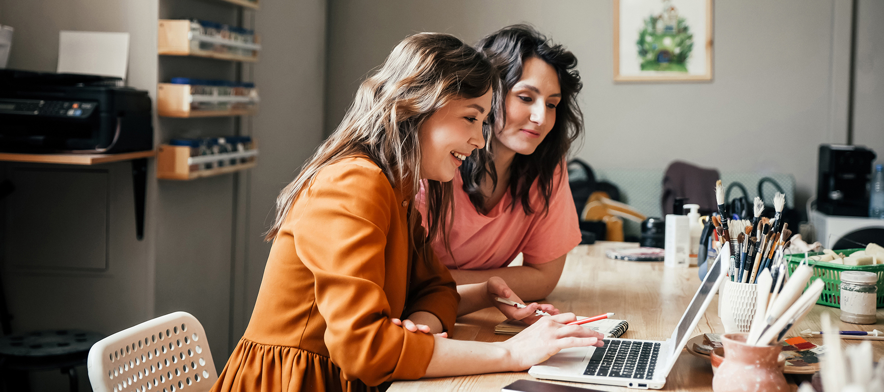 Women looking at a computer together